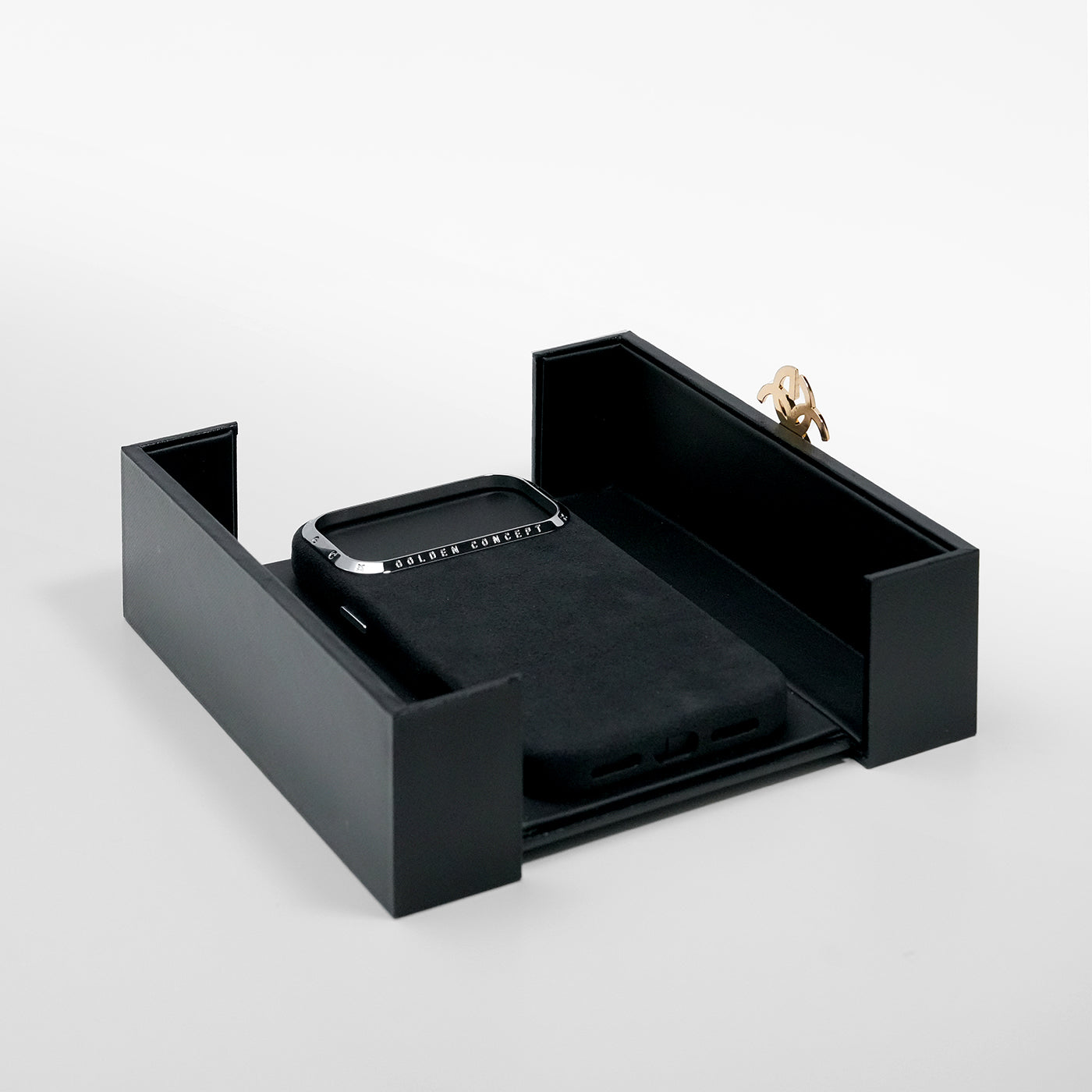 Black Alcantara iPhone 17 case presented in Golden Concept box