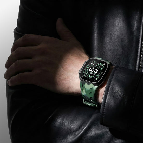 Close-up of green camouflage rubber strap on Apple Watch.