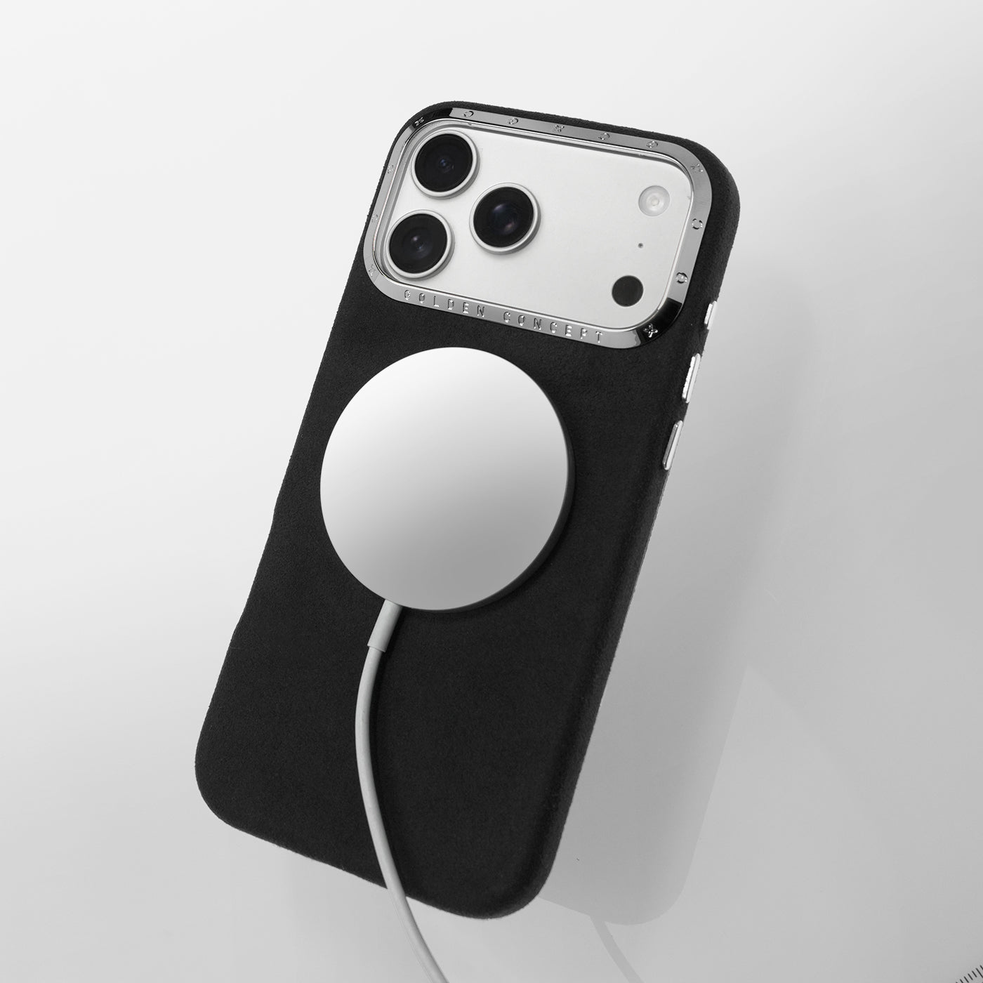 Black Alcantara iPhone 17 case with MagSafe charging and high-polished silver aluminum camera frame