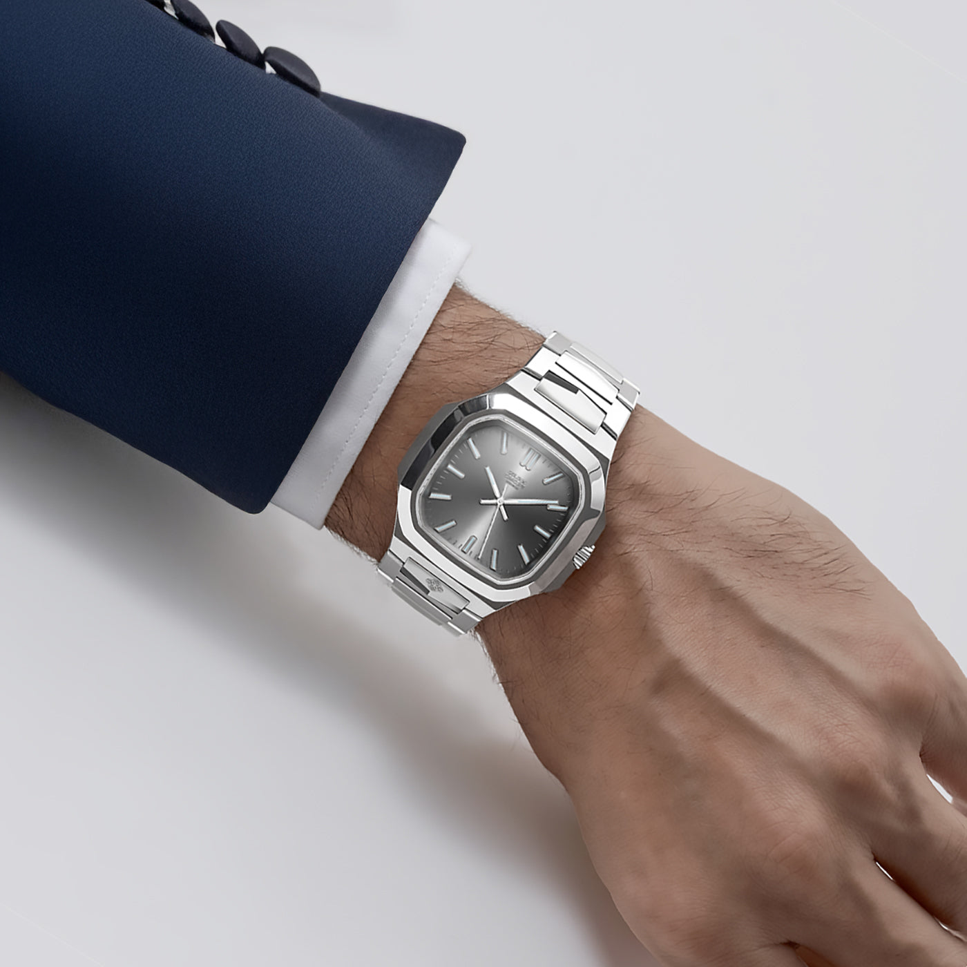 Golden Concept stainless steel watch worn on wrist with grey brushed sunburst dial and integrated bracelet