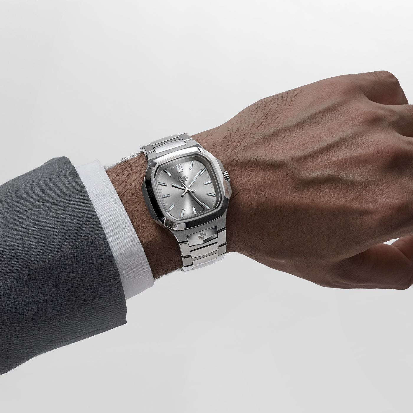 Golden Concept stainless steel watch worn on wrist with silver dial and integrated bracelet